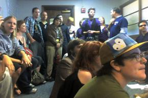 Supporters of same-sex marriage rights sit in at the San Diego County Administration Building to demand licences