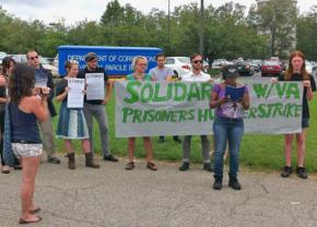 Solidarity activists hold a press conference outside a Department of Corrections office in Virginia