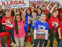 Striking teachers and their supporters stand united in the West Virginia Capitol building